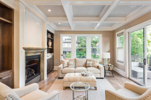 A cozy living room featuring a fireplace and comfortable couches, designed by Creative Solutions for a welcoming atmosphere.