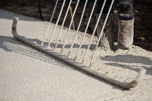A concrete mixer working to combine materials for a concrete driveway contractors project by .